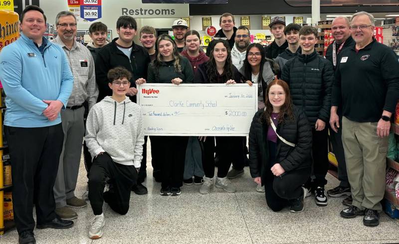 Osceola Hy-Vee made a $2,000 donation to the Clarke bowling team to help with replacing equipment after the Alley Bowl fire. Pictured are members of the bowling teams and coaching staff, Clarke administration and Hy-Vee management.