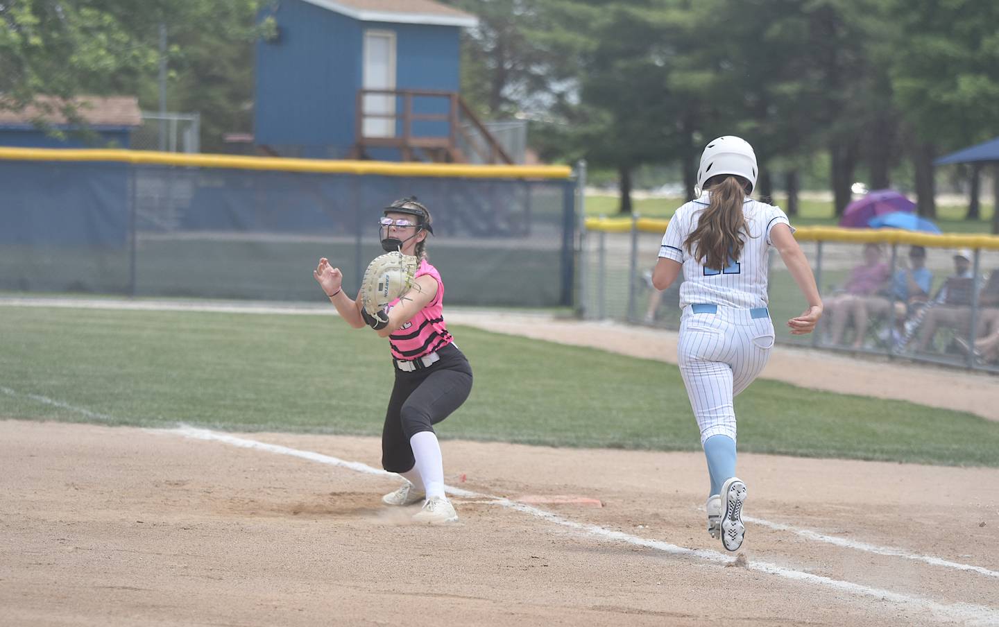 Maddie Youngs reaches for the ball to get East Union batter Gwen Nixon out at first. Clarke took on East Union in their first game of the John Stephens Classic tournament at Creston June 14.