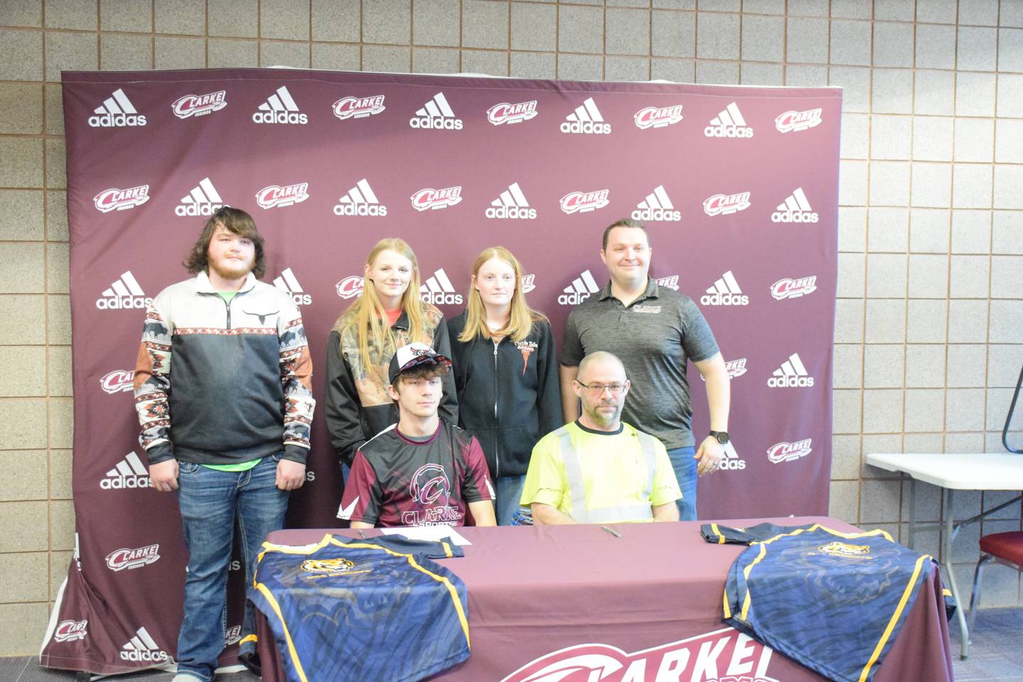 Hunter Reilli-Kight seated next to his father, Shaun Kight. In back from left are Kadan Hansen, Tabannah Keeton, Elizabeth Courtney and esports head coach Shane Wagoner.
