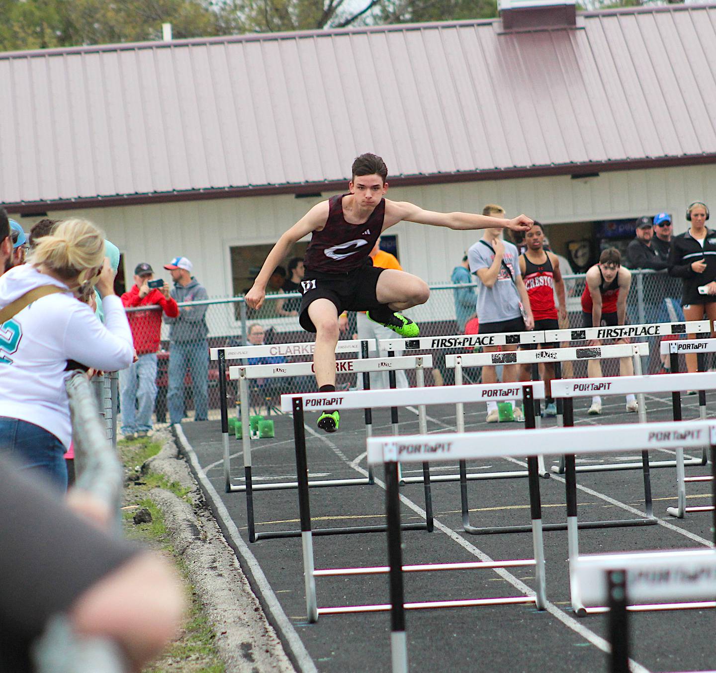 Levi White jumps a hurdle at Clarke's home meet on April 17.
