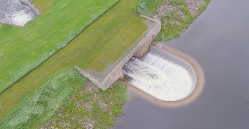 Water runs over the spillway at West Lake for the first time since 2021.