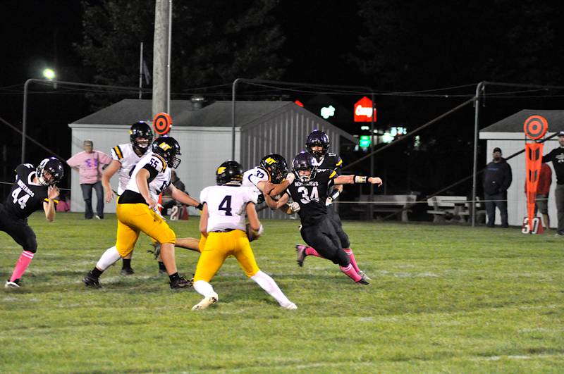 Nolan Gannon (#34) sets his sights on Mormon Trail’s quarterback (#4) at last Friday’s home game. Gannon logged five touchdowns and 247 total yards in the 50-26 win. A Mustang also pictured is #44 Jack Myers.