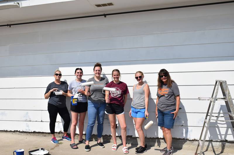 Osceola’s First Interstate Bank employees spent Sept. 10, the company-wide Volunteer Day, helping at C.R.O.S.S. Ministries. Taking a break from painting in the hot sun from left to right are Dawn Fry, Ava Shelton, Katie Dean, Mikala Sanson, Jaxsi Gilbert and Teresa Woods.