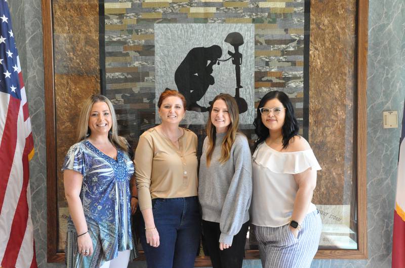 Members of the Clarke County Treasurer's office celebrate National Organ Donation month, which takes place annually in April. Left to right are: Brooke Caldwell, first deputy; Jessica Smith, treasurer; Shelby Hawxby, motor vehicle deputy; Esmeralda Elizondo, driver license examiner. Elizondo was the recipient of a kidney in 2022.