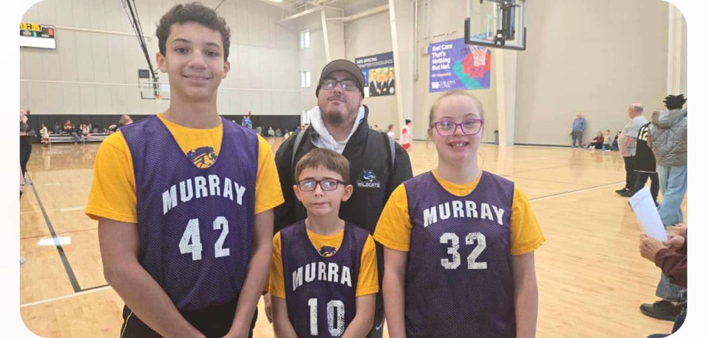 The Murray Special Olympics basketball team of Zavian Davis, Waylon Atkinson and Keylee Halls are moving on to the state tournament. Pictured in back is assistant coach Juan Echeverria.