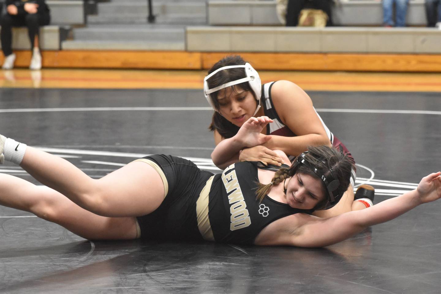 Clarke wrestler Alexe Severiano-Morales works on Glenwood's Ruby Roker.