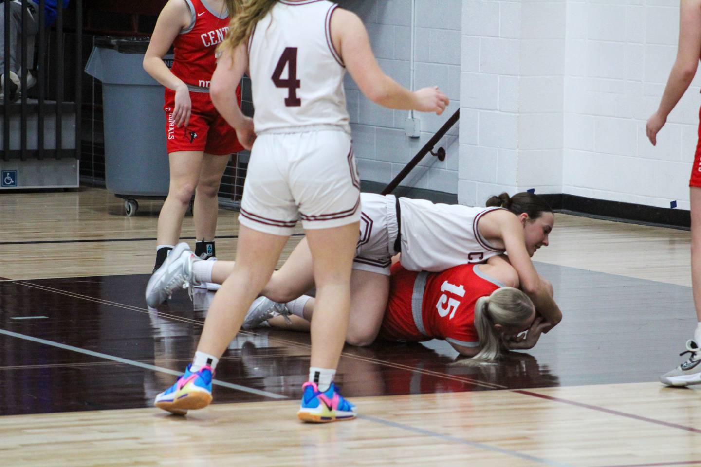 Clarke’s Reagan Fry fights to get the ball from a Central Decatur player at last Tuesday’s home game against the Cardinals.