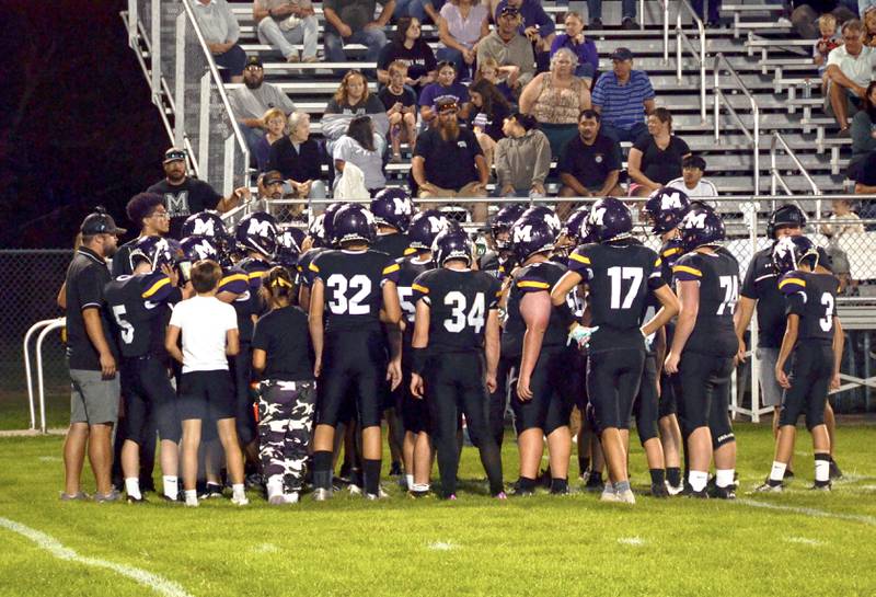 The Murray Mustangs regroup during a timeout.