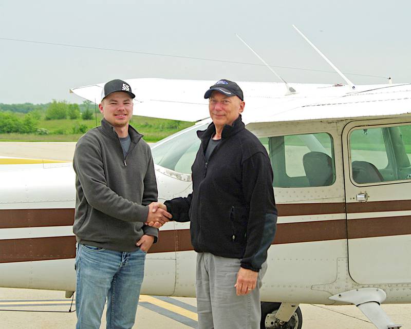 Toby Mosher, left, recently earned his Private Pilot Certificate. Kevin Seuferer, right, is a local flight instructor.
