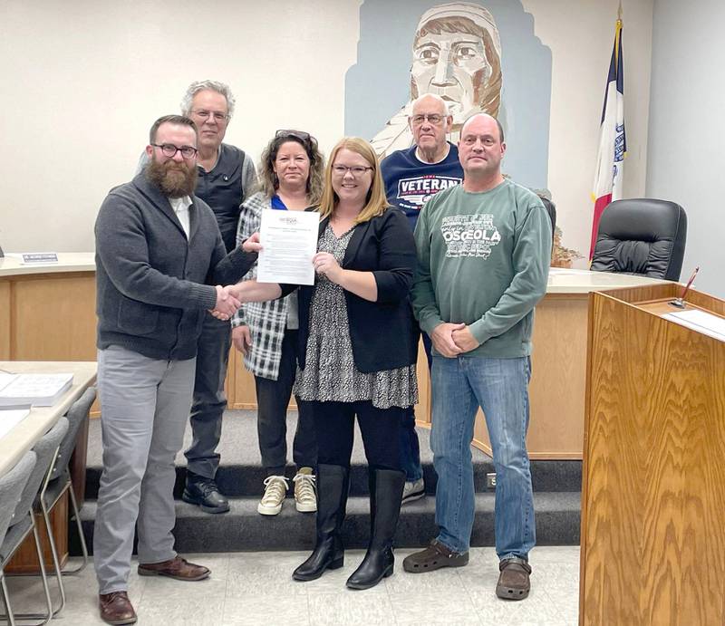 Osceola mayor Thomas Kedley (front left) signs a proclamation at the Jan. 16 Osceola City Council meeting proclaiming January as Human Trafficking Prevention Awareness Month. He is pictured with Adelaide Shea, representing Chains Interrupted, and council members starting back left: Dr. George Fotiadis, Sonya Hicks, Dan Hooper and Tom Bahls; councilman Jose Vargas was absent.