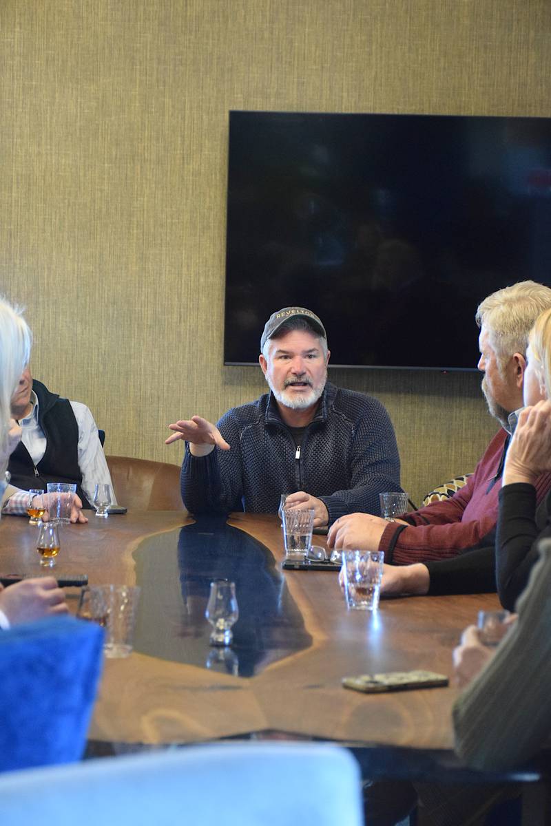 Rob Taylor, owner of Revelton Distilling Company, talks to legislators and lobbyists about the need for direct-to-consumer shipping bills for Iowa distilleries.