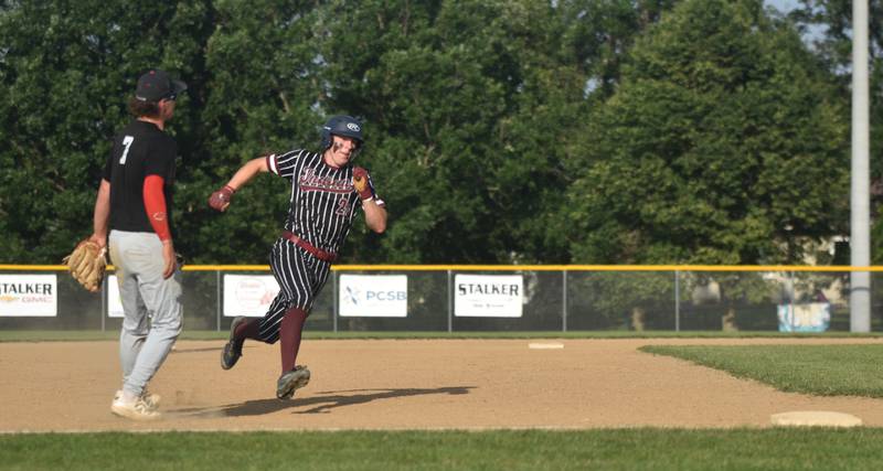Ethan Danley rounds third base in Clarke's second game against Creston June 13.