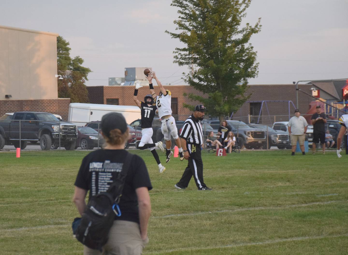 AJ Clarke (11) reaches for the ball as Lenox's Laramie Stoaks (2) blocks the pass.
